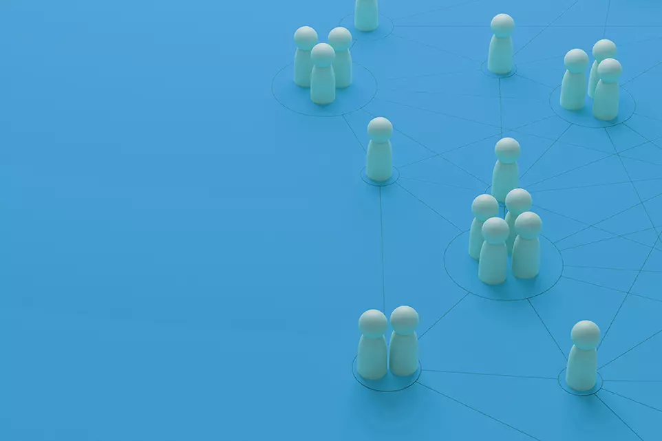On blue background standing white figures which represents the company employees and they are connected with each other with black lines where the black lines symbolize are the result of workforce management system